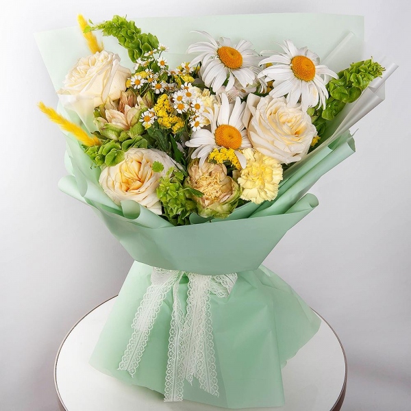 Gerbera white - 5, Chamomile - 1, White rose 50 cm Ecuador - 3, Rose Veggie 50 cm - 2, Yellow carnation - 4, Baltica White Spray Chrysanthemum - 1, Yellow Statice, Dried flowers in assortment, Wrapping Paper, Moluccella