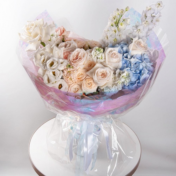 White rose 50 cm Ecuador - 2, Blue/purple hydrangea - 1, Spray peony rose  - 5, Carnation white, cream - 12, White Matthiola - 4, Baltica White Spray Chrysanthemum - 1, lisianthus - 1, Blue Delphinium, Wrapping Paper