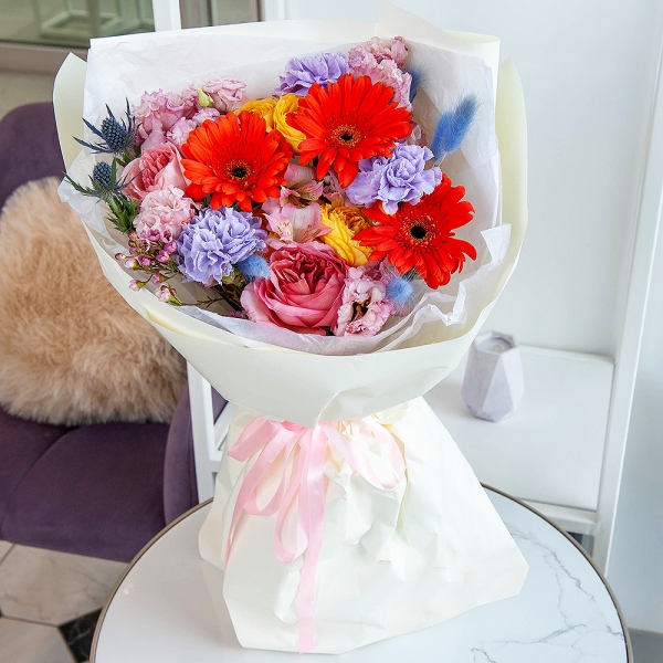 Lilac carnation - 3, Pink rose Pink X-pression 50 cm - 3, Pink Lisianthus (Eustoma) - 2, Spray rose: yellow, orange 50 cm - 2, Gerbera daisies - 3, Waxflower (1 pc.), Dried flowers in assortment, Eryngium, Eucalyptus, Wrapping Paper