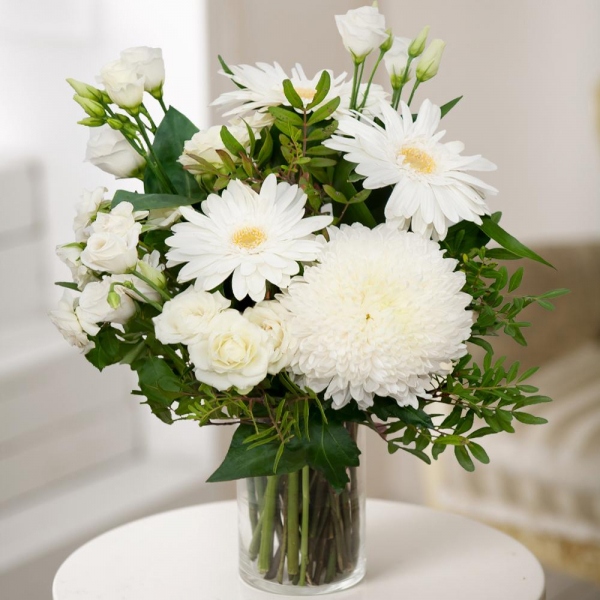 Magnum White Chrysanthemum - 1, Gerbera white - 3, lisianthus - 2, Spray rose: white, cream, light pink 50 cm - 3, Pistachio, Aspidistra (1 pc.), Wrapping Paper