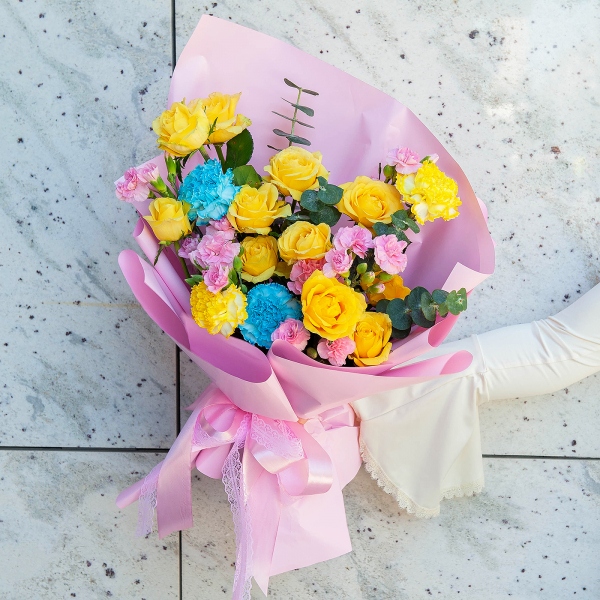 Spray rose: yellow, orange 50 cm - 5, Blue carnation - 4, Pink spray carnation - 5, Eucalyptus baby blue (1 pc.), Wrapping Paper