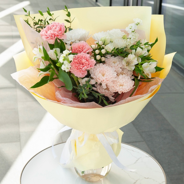 Pink carnation - 5, White Matthiola - 2, Baltica White Spray Chrysanthemum - 2, Alstromeria white, soft pink - 3, lisianthus - 1, Hypericum, Eucalyptus parvifolia (1 pc.), Wrapping Paper