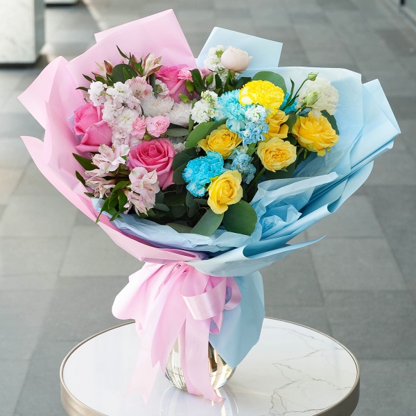 Rose Pink 50 cm Ecuador (Chelo, Hermosa, Novia, Titanik, Engagement, Pink Mondiale) - 7, Blue carnation - 5, Alstromeria white, soft pink - 6, White Matthiola - 2, Pink Matthiola - 3, Spray rose: yellow, orange 50 cm - 3, Baltica White Spray Chrysanthemum - 1, Pink spray carnation - 4, lisianthus - 2, Yellow carnation - 4, Eucalyptus populus (1 pc.), Wrapping Paper