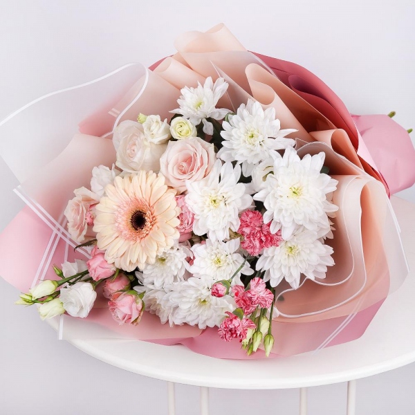 Gerbera pink - 1, Baltica White Spray Chrysanthemum - 2, Spray rose: white, cream, light pink 50 cm - 2, Pink spray carnation - 1, lisianthus - 1, Rose Cream 50 cm - 3, Wrapping Paper