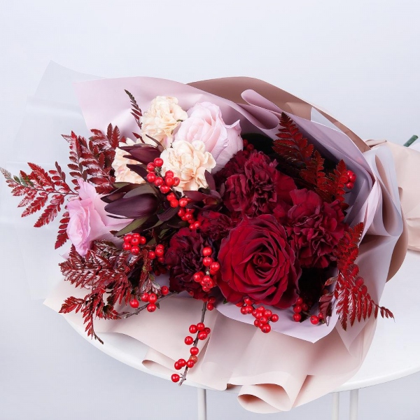 Red rose 50 cm - 1, Pink rose 50 cm - 2, Carnation red - 5, Carnation white, cream - 3, Fern (1 pc.), Leukodendron, Wrapping Paper, Ribbon, Ilex