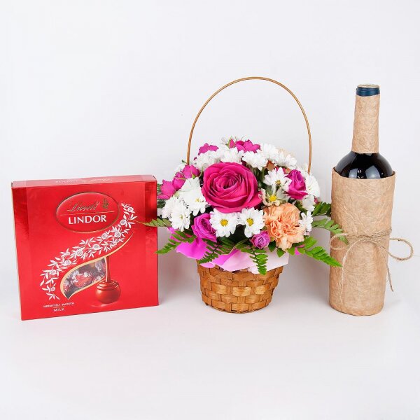Bright pink spray rose mix, 50 cm - 3, Orange carnation - 2, Santini White Spray Chrysanthemum - 3, Pink rose 50 cm - 2, Fern (1 pc.), Small Basket, Oasis, Lindt Candy Box, Non-alcoholic champagne or wine