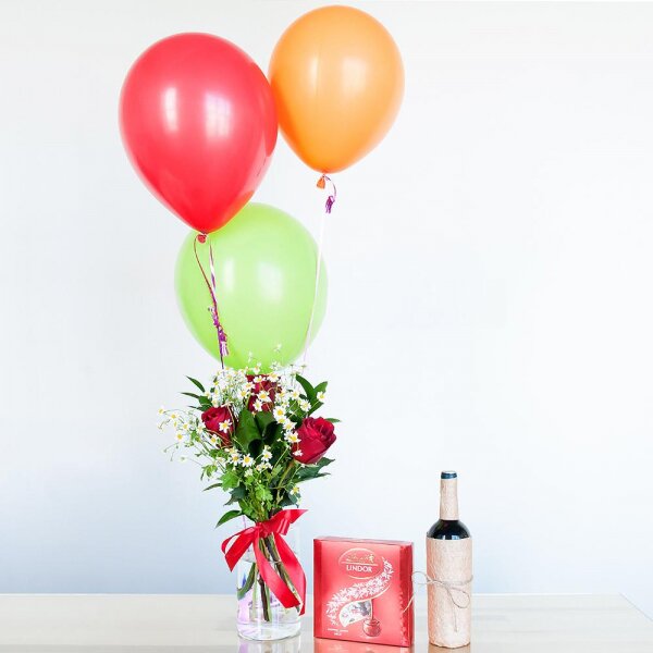 Red rose 50 cm - 7, Chamomile - 3, Aspidistra (1 pc.), Ruscus, Ribbon, Lindt Candy Box, Helium Balloon (1 pc.), Non-alcoholic champagne or wine
