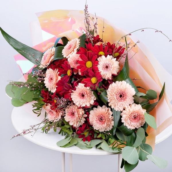 Gerbera pink - 11, Bacardi Red Spray Chrysanthemum - 4, Aspidistra (1 pc.), Eucalyptus Cinerea, Pistachio, Genista, Wrapping Paper, Ribbon