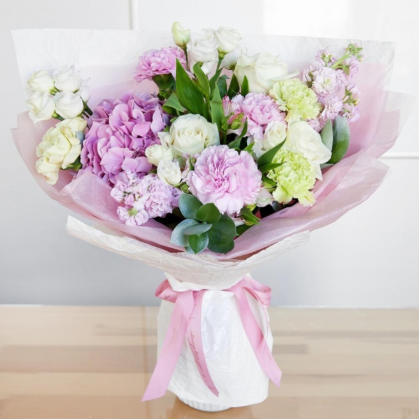 Pink Hydrangea - 1, Alstromeria white, soft pink - 2, Pink Matthiola - 3, White rose 50 cm - 3, lisianthus - 2, Green carnation - 3, Pink carnation - 3, Pistachio, Ruscus, Wrapping Paper
