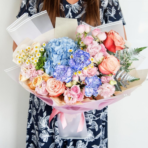 Blue/purple hydrangea - 1, Lilac carnation - 7, Peony rose Kahala 50 cm - 5, Spray rose: white, cream, light pink 50 cm - 6, Chamomile - 2, Pink Lisianthus (Eustoma) - 3, Fern (1 pc.), Wrapping Paper
