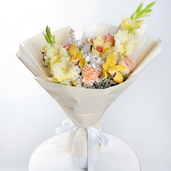 Bacardi White Spray Chrysanthemum - 1, White Gladiolus - 2, Orchid bud yellow/brown Cymbidium - 3, Carnation white, cream - 3, Pink rose 50 cm - 3, Flask for orchids, Solidago (1 pc.), Wrapping Paper