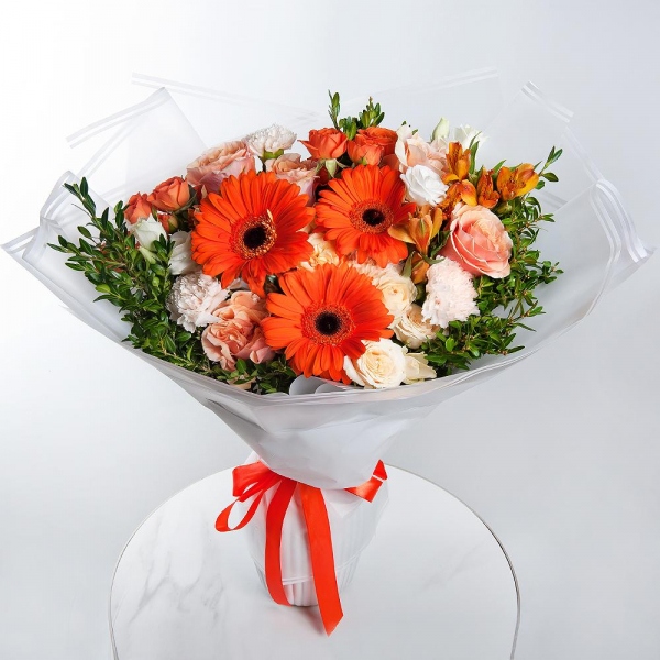 Gerbera daisies - 3, Pink-orange rose Phoenix 50 cm - 7, Alstromeria Yellow, Orange - 5, Spray rose: yellow, orange 50 cm - 2, lisianthus - 1, Carnation white, cream - 7, Spray rose: white, cream, light pink 50 cm - 2, Pistachio, Wrapping Paper