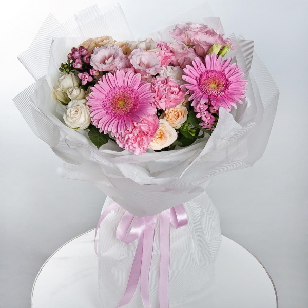 Gerbera pink - 2, Baltica White Spray Chrysanthemum - 1, Spray rose: white, cream, light pink 50 cm - 3, Pink carnation - 7, Pink Lisianthus (Eustoma) - 2,  Bouvardia, Wrapping Paper