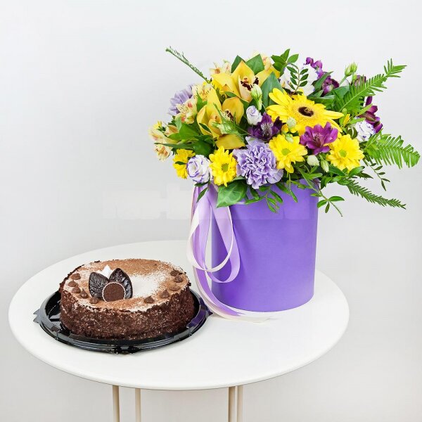Gerbera yellow - 1, Lilac carnation - 2, Orchid bud yellow/brown Cymbidium - 2, Alstromeria Yellow, Orange - 1, Purple Lisianthus (Eustoma) - 4, Bacardi Yellow Spray Chrysanthemum - 2, Alstromeria lilac, purple - 1, Round flower box small , Film, Oasis, Pistachio, Ruscus, Ambrella, Flask for orchids, Ribbon, Cake in assortment